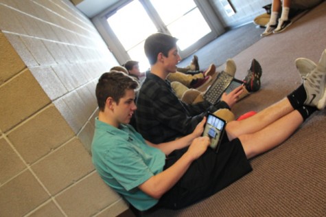 Joe Martin '18 playing on his iPad during academic support 