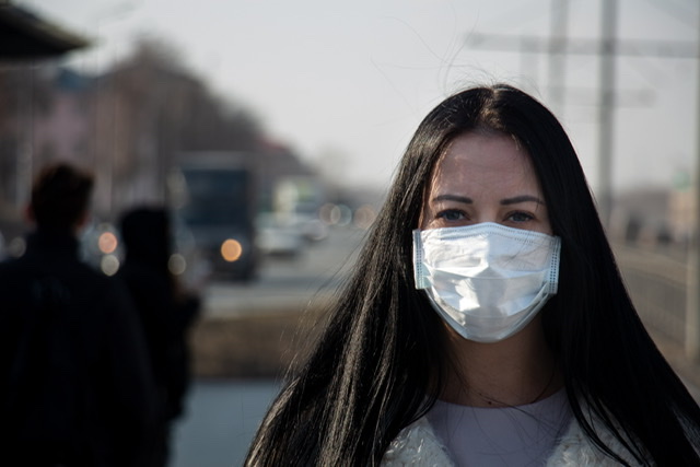 Woman wears a mask to avoid the large outbreak of new covid strain. Most recently it has peaked on the southern border as of January 7, 2021. 