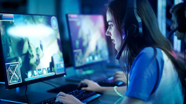 Female professional video gamer plays an MMORPG on her computer. (http://www.lyncconf.com/)