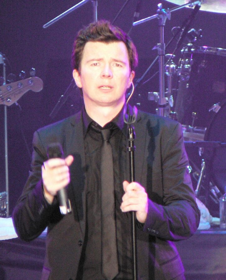 Rick Astley does the iconic pose his song “Never Gonna Give You Up” started with.