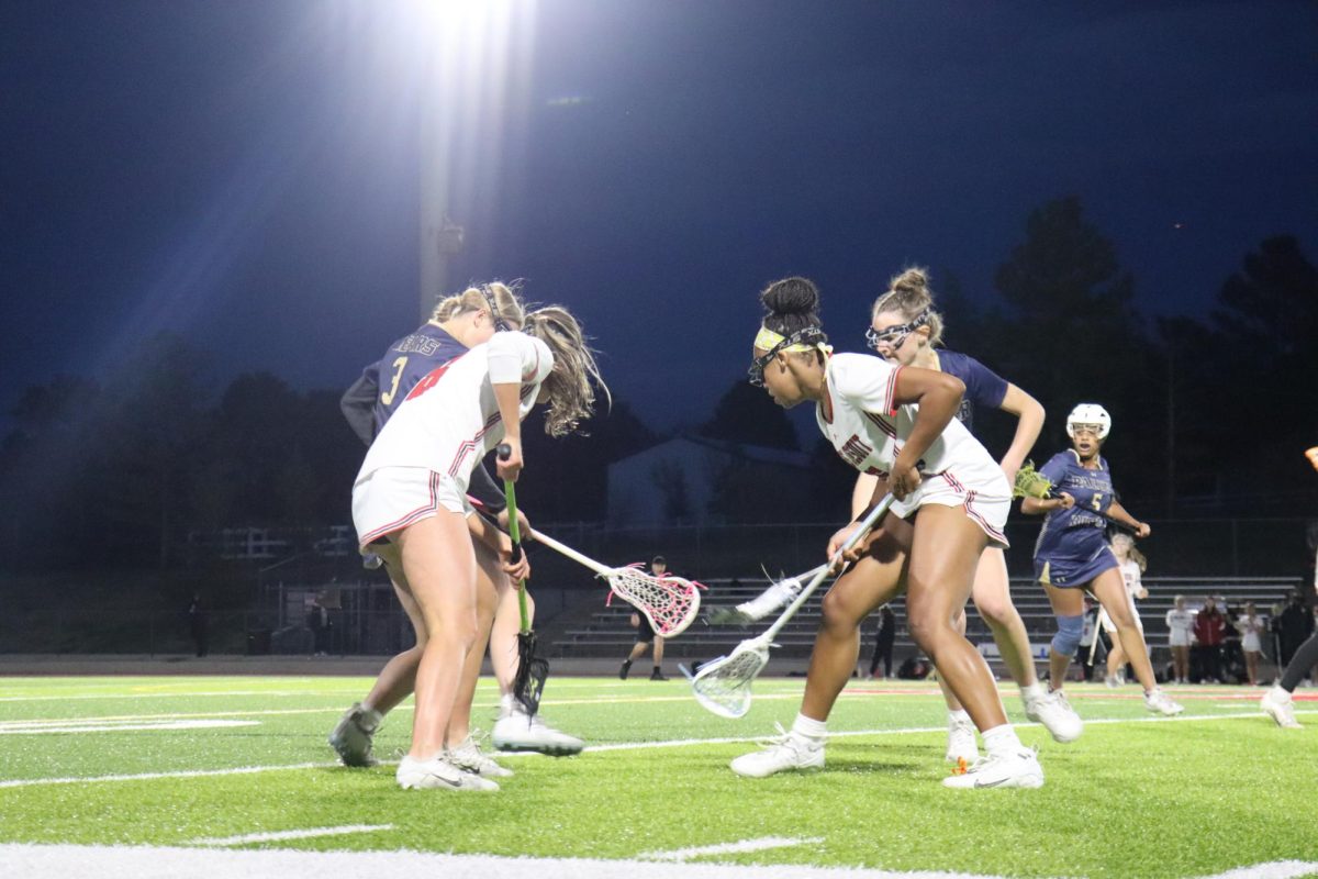 Jasmine Lugo '28 fights for the ball against 2 Palmer Ridge players.