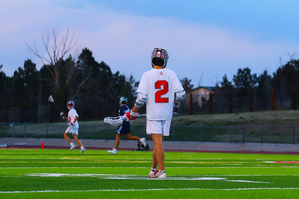 Sophomore Austin Ryan '27 leads the boy's Lacrosse team in goals this season, waiting to get the ball and put it in the back of the net.